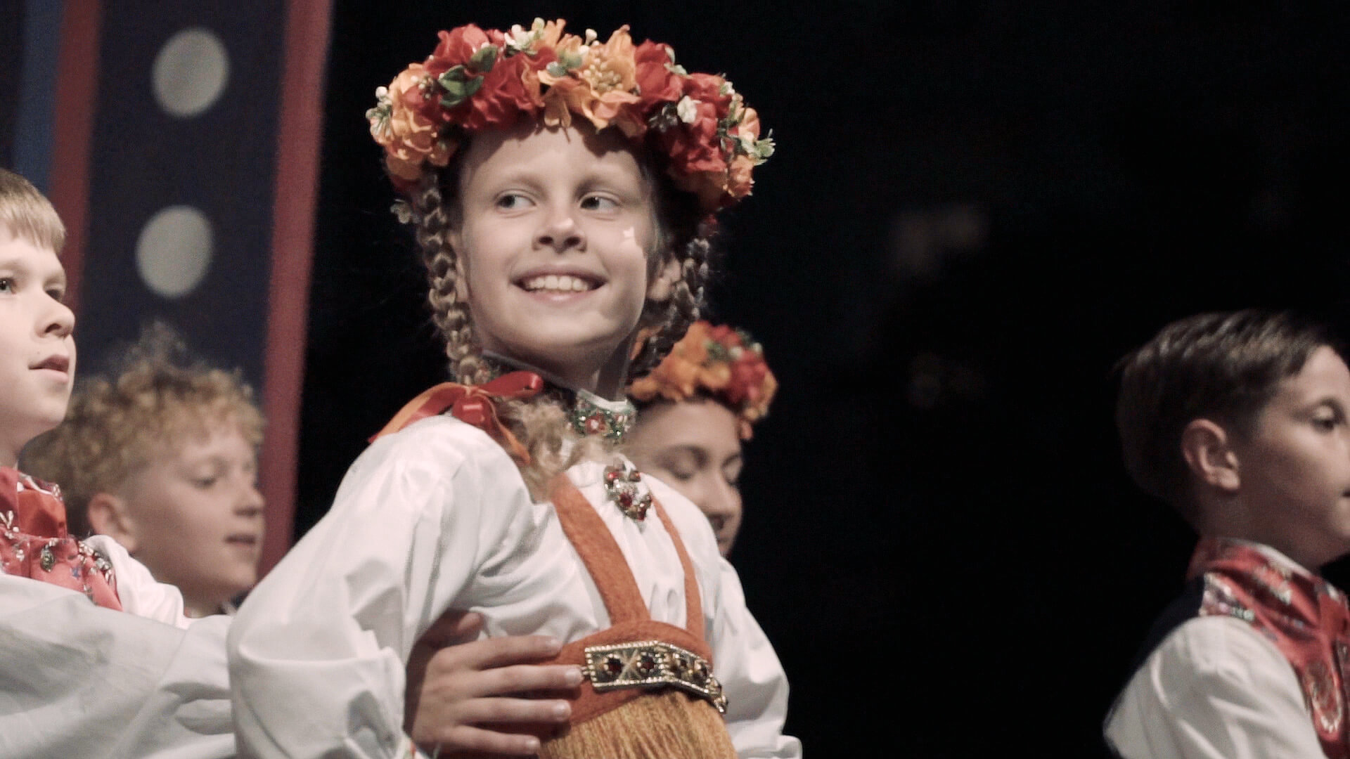 International folk dancers in traditional costumes performing in Europe.