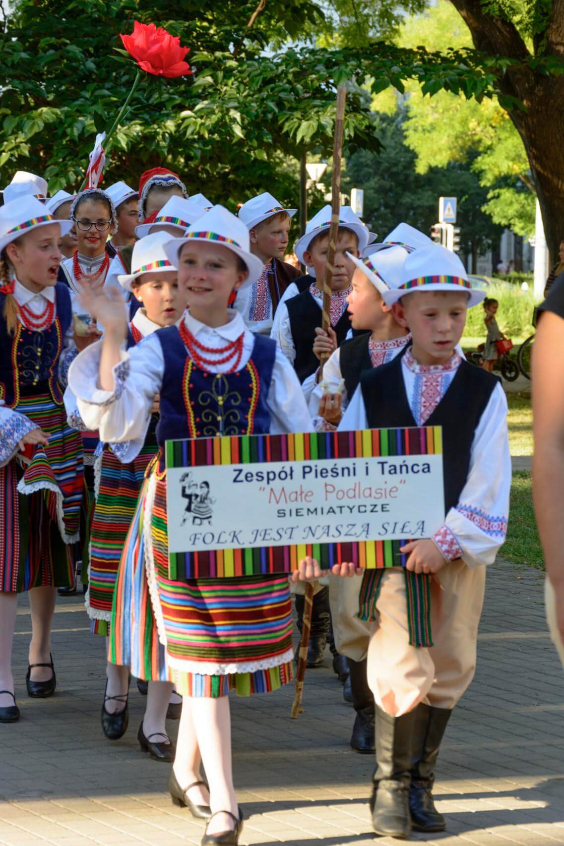 Dancers posing for a group photo in their costumes.